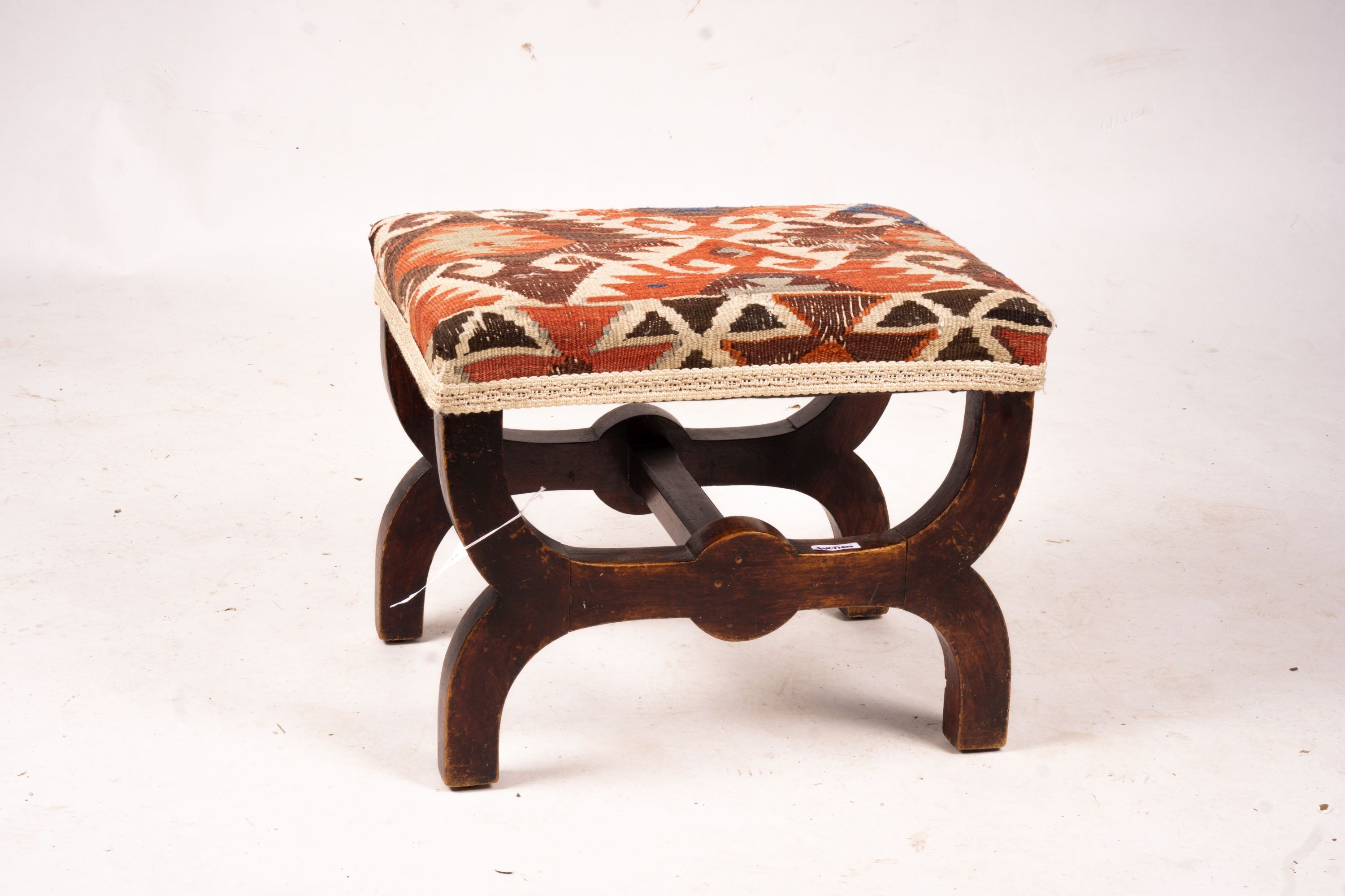 A Victorian beech 'X' framed stool with Kelim seat, length 48cm, depth 35cm, height 37cm